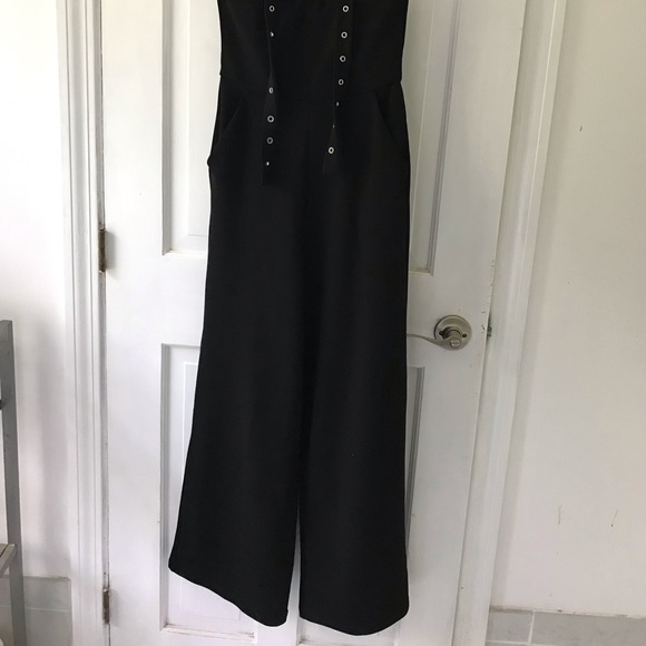 Black zip up jumpsuit w/ a metal clasp halter!! - Picture 2 of 3